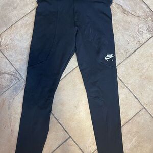 Nike tight fit 7/8 length leggings. Black size large.